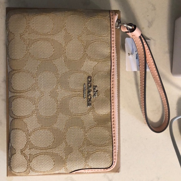 Coach Handbags - Coach wristlet. Brand new. With box